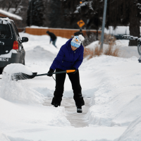 person shoveling snow